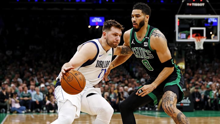 Jun 9, 2024; Boston, Massachusetts, USA; Dallas Mavericks guard Luka Doncic (77) drives to the basket against Boston Celtics forward Jayson Tatum (0) during game two of the 2024 NBA Finals at TD Garden. Mandatory Credit: Peter Casey-Imagn Images