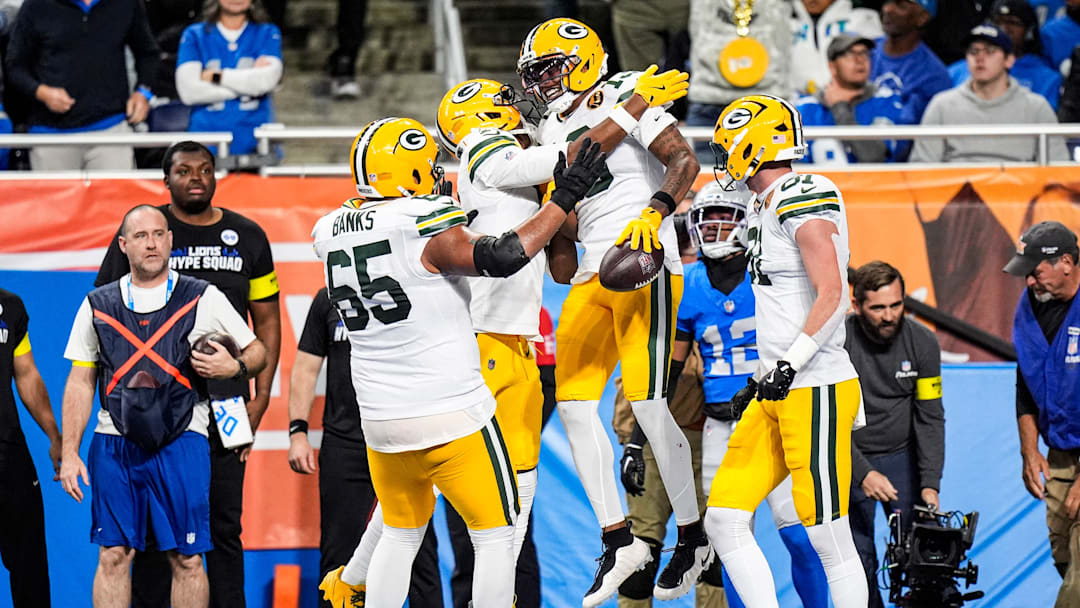 Green Bay Packers wide receiver Dontayvion Wicks (13) celebrates a touchdown against Green Bay Packers during the first half at Ford Field in Detroit on Thursday, Nov. 27, 2025.
