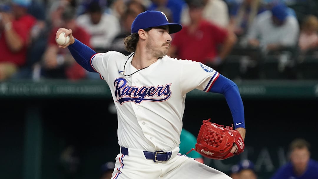 Texas Rangers pitcher Cole Winn throws to the plate.