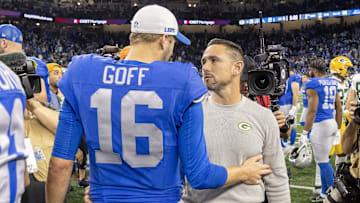 Nov 23, 2023; Detroit, Michigan, USA; Green Bay Packers Head Coach Matt LaFleur talks to Detroit Lions quarterback Jared Goff (16) after the annual Thanksgiving Day game at Ford Field. Mandatory Credit: David Reginek-Imagn Images