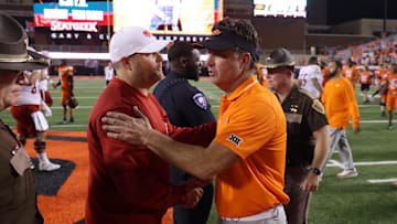 Stillwater, Oklahoma, USA; Oklahoma State coach Mike Gundy, right, talks with South Alabama coach Kane Wommack after an NCAA football game between Oklahoma State and South Alabama at Boone Pickens Stadium. South Alabama won 33-7. 