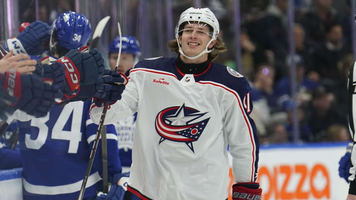 Dec 14, 2023; Toronto, Ontario, CAN; Columbus Blue Jackets forward Kent Johnson (91) gets congratulated after scoring against the Toronto Maple Leafs during the first period at Scotiabank Arena. Mandatory Credit: John E. Sokolowski-USA TODAY Sports