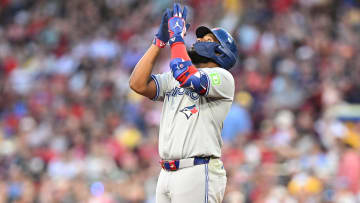 Jun 25, 2024; Boston, Massachusetts, USA; Toronto Blue Jays first baseman Vladimir Guerrero Jr. (27) reacts after hitting a two-run RBI double against the Boston Red Sox during the third inning at Fenway Park.