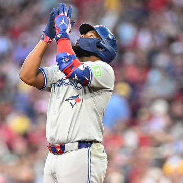 Jun 25, 2024; Boston, Massachusetts, USA; Toronto Blue Jays first baseman Vladimir Guerrero Jr. (27) reacts after hitting a two-run RBI double against the Boston Red Sox during the third inning at Fenway Park.