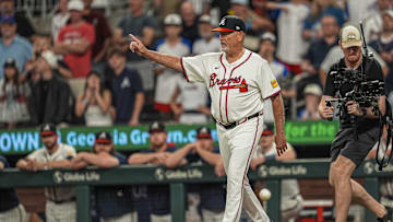Jun 18, 2025; Cumberland, Georgia, USA; Atlanta Braves manager Brian Snitker (43) walks to the mound to replace starting pitcher Chris Sale (51) (not shown) against the New York Mets during the ninth inning at Truist Park. Mandatory Credit: Dale Zanine-Imagn Images