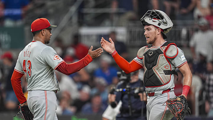 Sep 9, 2024; Cumberland, Georgia, USA; Cincinnati Reds relief pitcher Alexis Diaz (43) and catcher Tyler Stephenson (37) react after defeating the Atlanta Braves at Truist Park. Mandatory Credit: Dale Zanine-Imagn Images