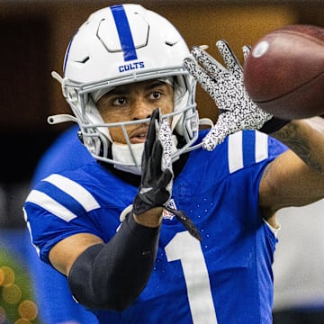 Dec 31, 2023; Indianapolis, Indiana, USA; Indianapolis Colts wide receiver Josh Downs (1) catches a ball during warmups before the game against the Las Vegas Raiders  at Lucas Oil Stadium. Mandatory Credit: Trevor Ruszkowski-Imagn Images