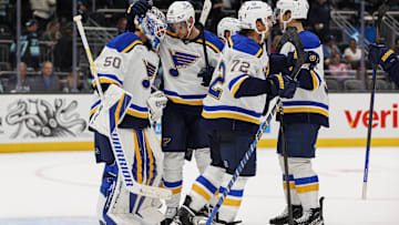 Oct 8, 2024; Seattle, Washington, USA; St. Louis Blues center Radek Faksa (12) embraces goaltender Jordan Binnington (50) after the game against the Seattle Kraken at Climate Pledge Arena. Mandatory Credit: Caean Couto-Imagn Images