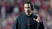 Nov 22, 2025; Madison, Wisconsin, USA; Wisconsin Badgers head coach Luke Fickell talks to his team during the second half against the Illinois Fighting Illini at Camp Randall Stadium.
