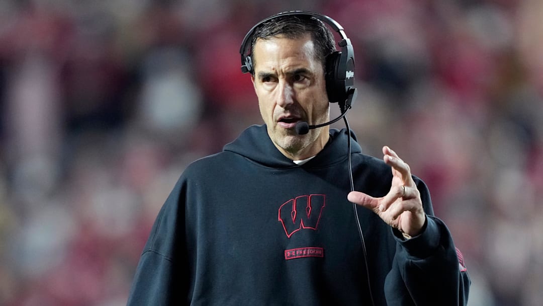 Wisconsin Badgers head coach Luke Fickell talks to his team during the second half against the Illinois Fighting Illini at Camp Randall Stadium.