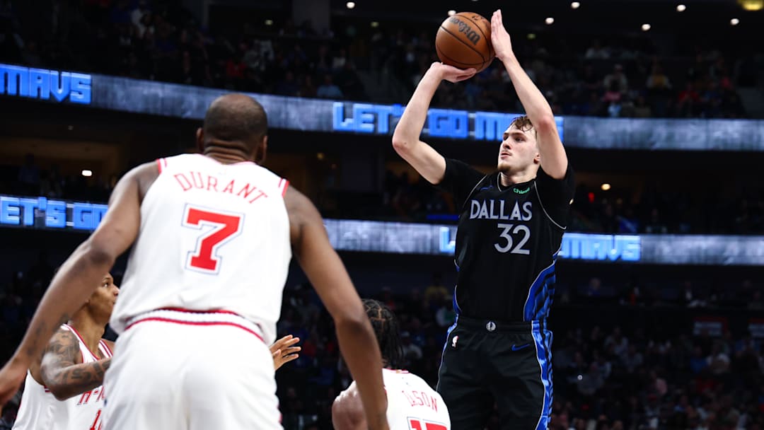 Jan 3, 2026; Dallas, Texas, USA; Dallas Mavericks forward Cooper Flagg (32) shoots over Houston Rockets forward Tari Eason (17) and Houston Rockets forward Kevin Durant (7) during the second half at American Airlines Center. Mandatory Credit: Kevin Jairaj-Imagn Images