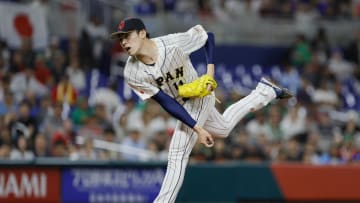 Mar 20, 2023; Miami, Florida, USA; Japan starting pitcher Roki Sasaki (14) delivers a pitch during the first inning against Mexico at LoanDepot Park. Mandatory Credit: Sam Navarro-USA TODAY Sports