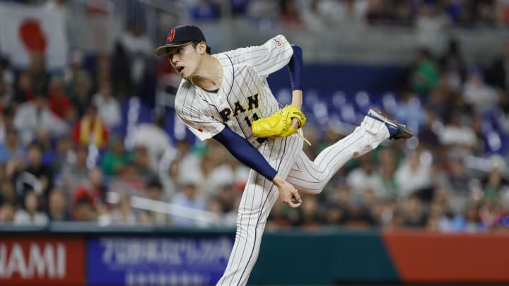 Mar 20, 2023; Miami, Florida, USA; Japan starting pitcher Roki Sasaki (14) delivers a pitch during the first inning against Mexico at LoanDepot Park.