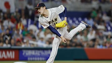 Mar 20, 2023; Miami, Florida, USA; Japan starting pitcher Roki Sasaki (14) delivers a pitch during the first inning against Mexico at LoanDepot Park. Mandatory Credit: Sam Navarro-Imagn Images