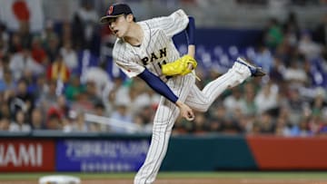 Mar 20, 2023; Miami, Florida, USA; Japan starting pitcher Roki Sasaki (14) delivers a pitch during the first inning against Mexico at LoanDepot Park. Mandatory Credit: Sam Navarro-Imagn Images