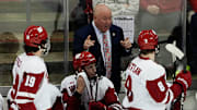Wisconsin Head Coach Mike Hastings speaks to forward William Whitelaw (8) during the second period of the match against Michigan St. on Saturday March 2, 2024 at the Kohl Center in Madison, Wis.