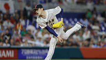 Mar 20, 2023; Miami, Florida, USA; Japan starting pitcher Roki Sasaki (14) delivers a pitch during the first inning against Mexico at LoanDepot Park. Mandatory Credit: Sam Navarro-Imagn Images