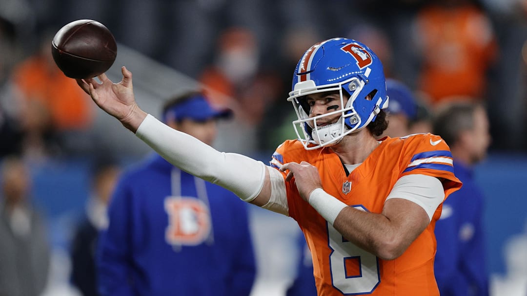 Denver Broncos quarterback Jarrett Stidham practices before the game at Empower Field at Mile High.