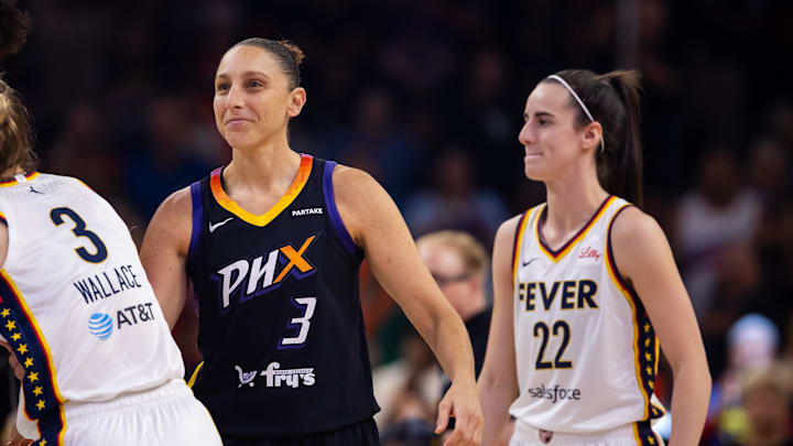 Jun 30, 2024; Phoenix, Arizona, USA; Indiana Fever guard Caitlin Clark (22) against Phoenix Mercury guard Diana Taurasi (3) during a WNBA game at Footprint Center. Mandatory Credit: Mark J. Rebilas-Imagn Images