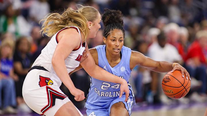 Mar 7, 2026; Duluth, GA, USA; North Carolina Tar Heels guard Indya Nivar (24) is defended by Louisville Cardinals forward Laura Ziegler (0) in the first quarter at Gas South Arena. Mandatory Credit: Brett Davis-Imagn Images