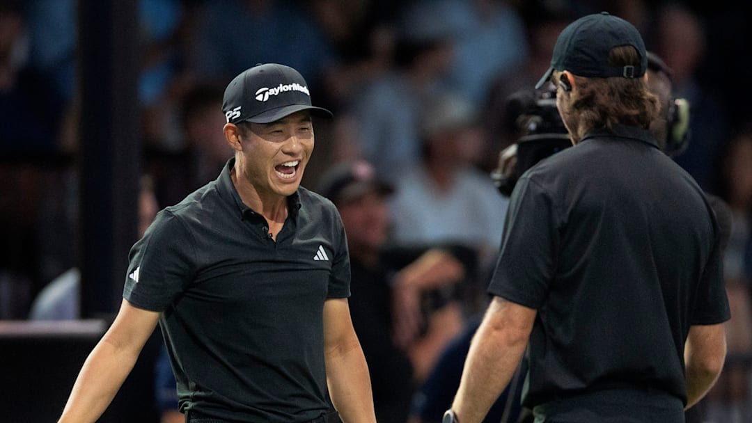 Collin Morikawa, left, celebrates a great shot by Tommy Fleetwood of Los Angeles Golf Club during their TGL playoff semifinal against New York Golf Club at SoFi Center on March 17, 2025, in Palm Beach Gardens, Florida.