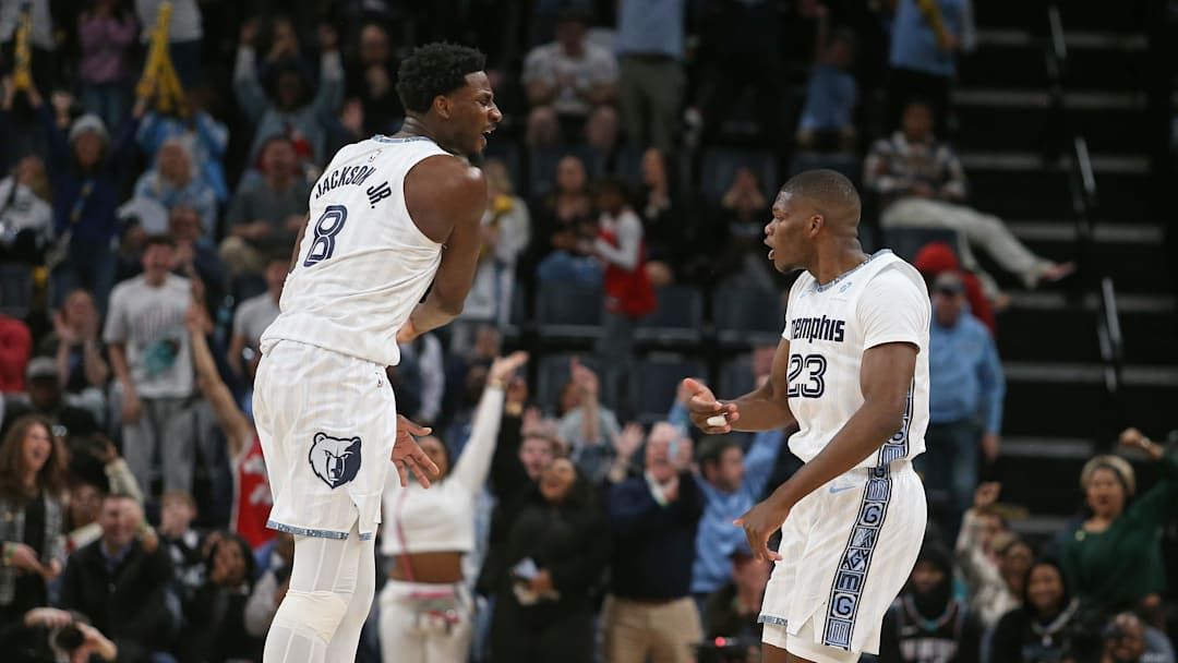 Jan 11, 2026; Memphis, Tennessee, USA; Memphis Grizzlies forward/center Jaren Jackson Jr. (8) reacts with forward Cedric Coward (23) during the fourth quarter against the Brooklyn Nets at FedExForum. Mandatory Credit: Petre Thomas-Imagn Images