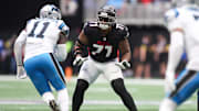 Nov 16, 2025; Atlanta, Georgia, USA; Atlanta Falcons offensive lineman Elijah Wilkinson (71) defends Carolina Panthers outside linebacker Nic Scourton (11) in the second quarter at Mercedes-Benz Stadium. Mandatory Credit: Brett Davis-Imagn Images
