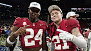 Alabama Crimson Tide wide receiver Emmanuel Henderson Jr. (24) and defensive back Jake Pope (21) celebrate after defeating the Georgia Bulldogs in the SEC championship game at Mercedes-Benz Stadium. 