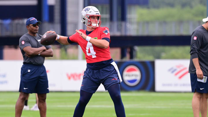 Jul 24, 2024; Foxborough, MA, USA;  New England Patriots quarterback Bailey Zappe (4)  throws a pass during training camp at Gillette Stadium. Mandatory Credit: Eric Canha-USA TODAY Sports