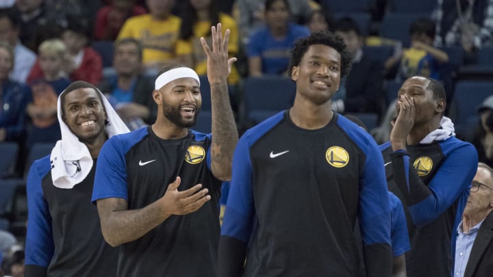 September 29, 2018; Oakland, CA, USA; Golden State Warriors forward Kevon Looney (5), center DeMarcus Cousins (0), center Damian Jones (15), and forward Kevin Durant (35) talk during a timeout in the fourth quarter against the Minnesota Timberwolves at Oracle Arena. The Timberwolves defeated the Warriors 114-110. Mandatory Credit: Kyle Terada-USA TODAY Sports