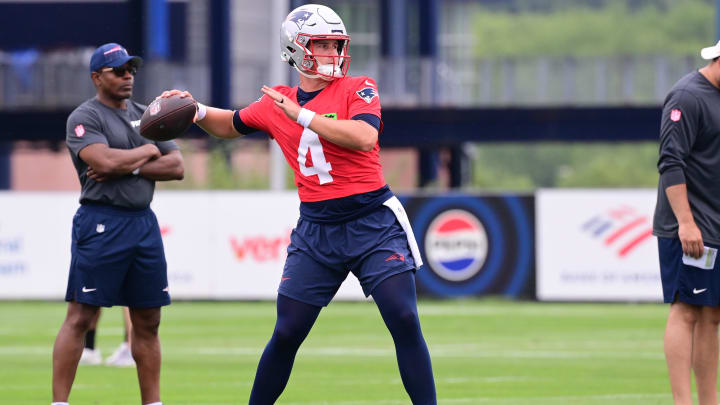 Jul 24, 2024; Foxborough, MA, USA;  New England Patriots quarterback Bailey Zappe (4)  throws a pass during training camp at Gillette Stadium. Mandatory Credit: Eric Canha-USA TODAY Sports