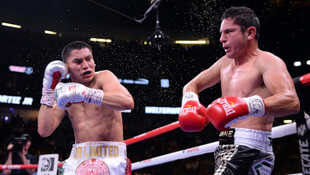 Vergil Ortiz Jr. (white trunks) and Mauricio Herrera (gray trunks) during their welterweight bout at T-Mobile Arena. 