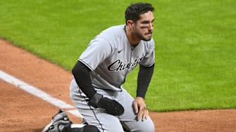 Chicago White Sox outfielder Mike Tauchman (18) was tagged out at home plate to end the game against the Cleveland Guardians at Progressive Field. 