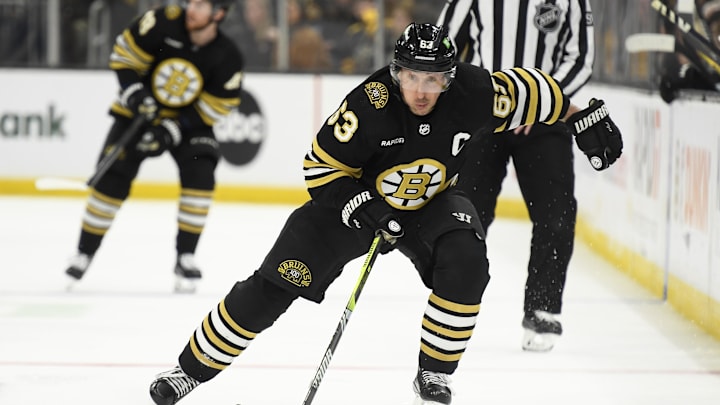 Apr 6, 2024; Boston, Massachusetts, USA; Boston Bruins left wing Brad Marchand (63) skates with the puck during the third period against the Florida Panthers at TD Garden. Mandatory Credit: Bob DeChiara-Imagn Images