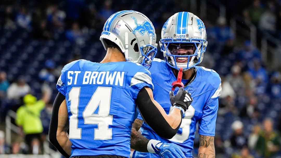 Detroit Lions wide receiver Amon-Ra St. Brown (14) talks to wide receiver Jameson Williams (9) at warm up before the game between Detroit Lions and Green Bay Packers at Ford Field in Detroit on Thursday, Dec. 5, 2024.