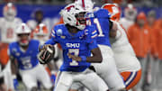 Dec 7, 2024; Charlotte, NC, USA; Southern Methodist Mustangs quarterback Kevin Jennings (7) throws during the second quarter against the Clemson Tigers in the 2024 ACC Championship game at Bank of America Stadium. Mandatory Credit: Jim Dedmon-Imagn Images