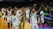 Mar 21, 2025; Seattle, WA, USA; Oregon Ducks guard Jayson Williams-Johnson (14) and guard Ra'Heim Moss (0) react after the game against the Liberty Flames in the first round of the NCAA Tournament at Climate Pledge Arena. Mandatory Credit: Steven Bisig-Imagn Images
