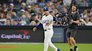 Oct 28, 2025; Los Angeles, California, USA; Los Angeles Dodgers manager Dave Roberts (30) makes a pitching change during the seventh inning against the Toronto Blue Jays during game four of the 2025 MLB World Series at Dodger Stadium. Mandatory Credit: Jayne Kamin-Oncea-Imagn Images