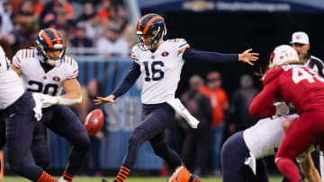 Dec 24, 2023; Chicago, Illinois, USA;  Chicago Bears punter Trenton Gill (16) punts against the Arizona Cardinals at Soldier Field.