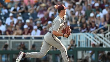 Jun 24, 2024; Omaha, NE, USA;  Texas A&M Aggies starting pitcher Justin Lamkin (33) throws against the Tennessee Volunteers during the first inning at Charles Schwab Field Omaha. Mandatory Credit: Steven Branscombe-USA TODAY Sports