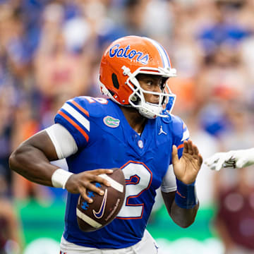 Sep 14, 2024; Gainesville, Florida, USA; Florida Gators quarterback DJ Lagway (2) evades Texas A&M Aggies defensive lineman Shemar Stewart (4) during the first half at Ben Hill Griffin Stadium. Mandatory Credit: Matt Pendleton-Imagn Images
