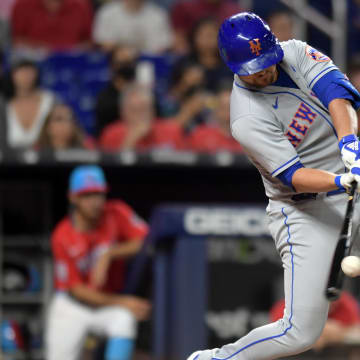 Jul 30, 2022; Miami, Florida, USA; New York Mets designated hitter J.D. Davis (28) hits a home run against the Miami Marlins in the eighth inning at loanDepot Park. Mandatory Credit: Jim Rassol-USA TODAY Sports