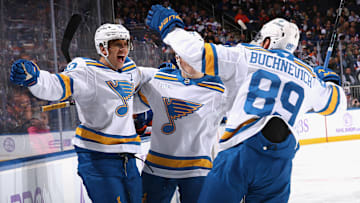 Brayden Schenn, Dalibor Dvorksy, and Pavel Buchnevich celebrating a rush goal