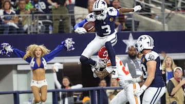 Dallas Cowboys wide receiver George Pickens hurdles Kansas City Chiefs cornerback Trent McDuffie at AT&T Stadium 