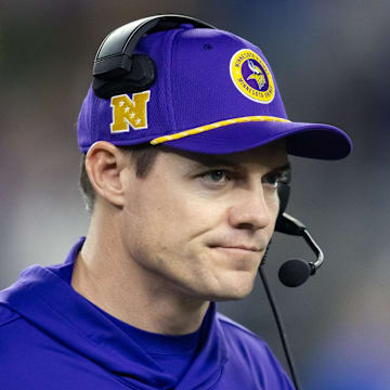 Minnesota Vikings coach Kevin O'Connell stands on the sidelines during a game.