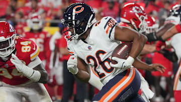 Aug 22, 2024; Kansas City, Missouri, USA; Chicago Bears wide receiver John Jackson III (26) runs the ball as Kansas City Chiefs defensive end Malik Herring (94) defends during the game at GEHA Field at Arrowhead Stadium. Mandatory Credit: Denny Medley-Imagn Images