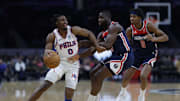 Feb 10, 2024; Washington, District of Columbia, USA; Philadelphia 76ers guard Tyrese Maxey (0) drives to the basket as Washington Wizards forward Eugene Omoruyi (97) defends in the first half at Capital One Arena. Mandatory Credit: Geoff Burke-Imagn Images