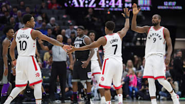 Dec 10, 2017; Sacramento, CA, USA; Toronto Raptors guard Kyle Lowry (7) celebrates with guard DeMar DeRozan (10) and forward Serge Ibaka (9) during the third quarter against the Sacramento Kings at Golden 1 Center. Mandatory Credit: Sergio Estrada-Imagn Images