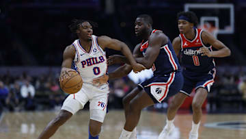 Feb 10, 2024; Washington, District of Columbia, USA; Philadelphia 76ers guard Tyrese Maxey (0) drives to the basket as Washington Wizards forward Eugene Omoruyi (97) defends in the first half at Capital One Arena. Mandatory Credit: Geoff Burke-Imagn Images