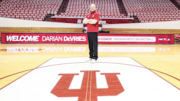 Indiana men's basketball coach Darian DeVries poses on the Simon Skjodt Assembly Hall court on March 18, 2025, the day he was introduced as the new coach.